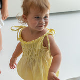 raphael hand smocked romper - yellow