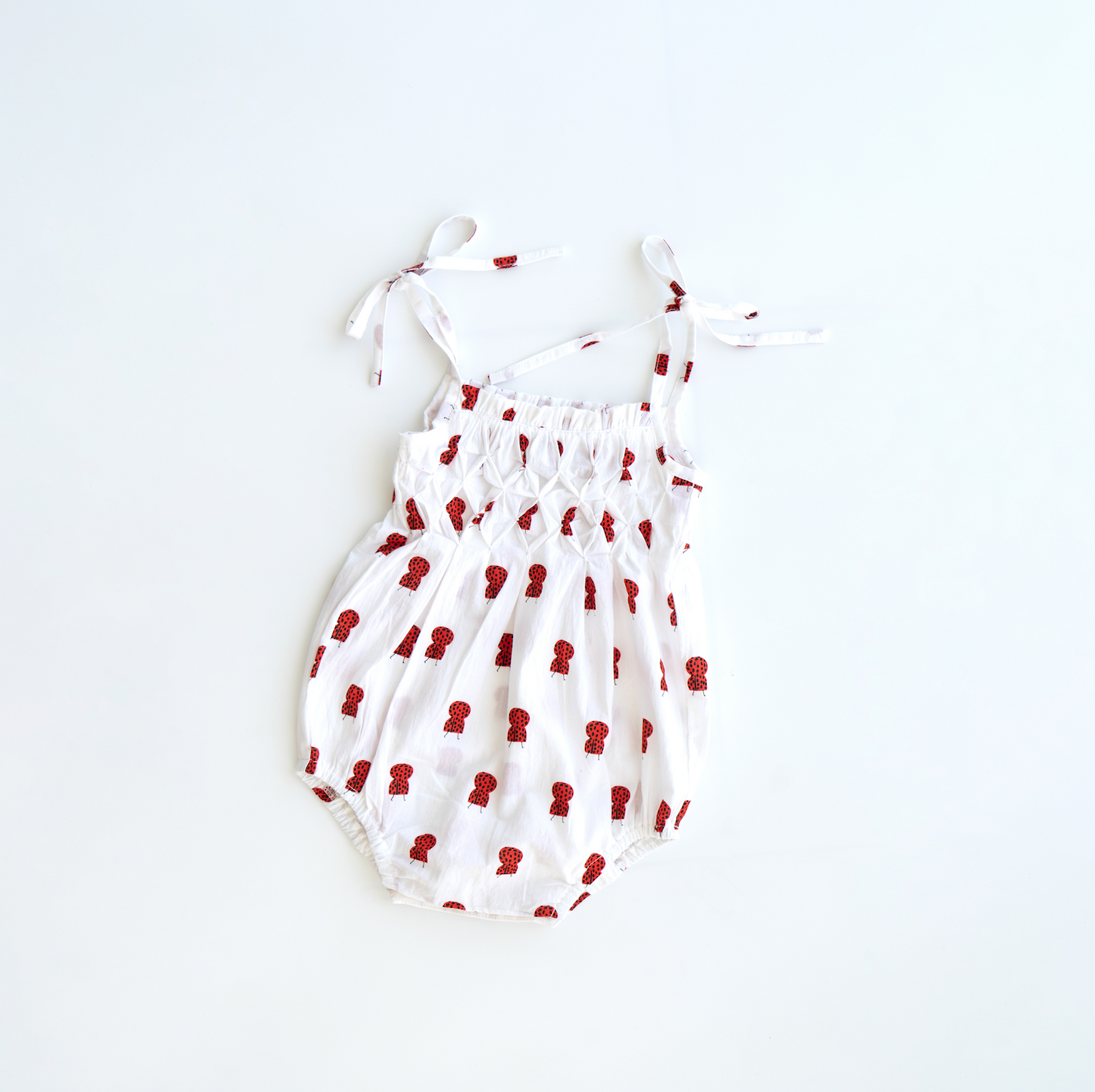 raphael hand smocked romper - lady bug